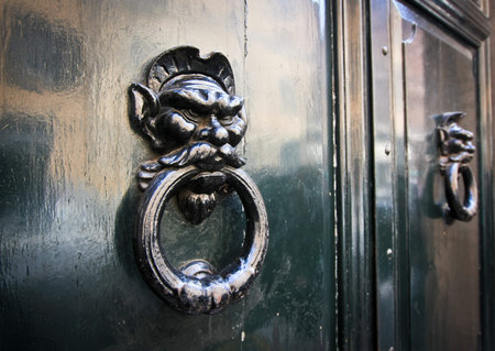 Door knockers with eastern faces in Rome