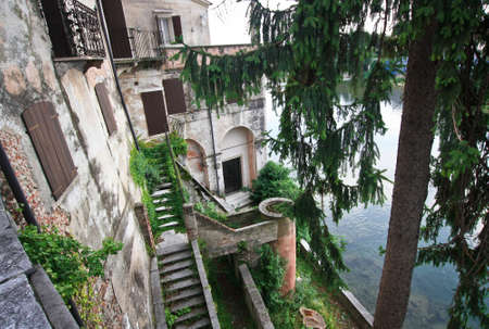 Beauty building above the river in Italyの写真素材