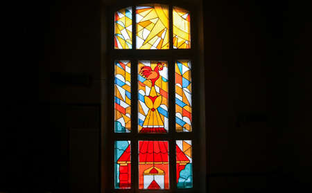 Stained glass with a cock on the spire from the fairy taleのeditorial素材