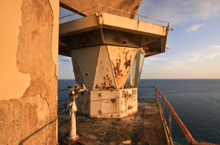 Old lighthouse on the roof of the sea