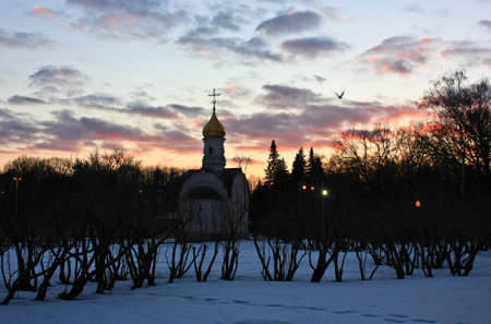 Church and sunset in the parkの写真素材