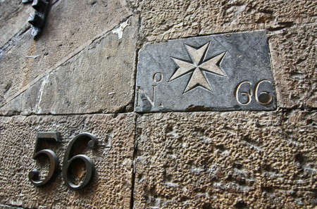 Maltese Cross and house number on the wallのeditorial素材