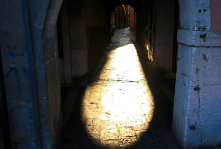 Sunset in the archway in the Italian townの写真素材