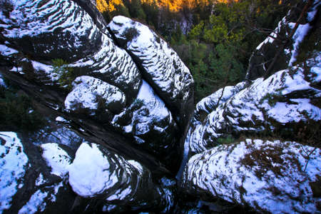Snow-covered rocks, view from Bastei bridgeの写真素材