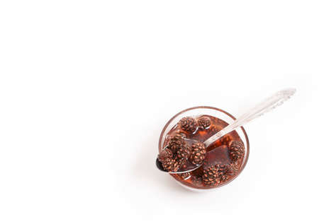 Pine cones jam on white backgroundの写真素材