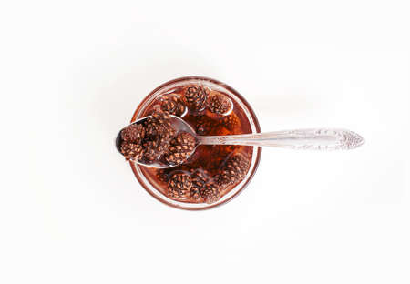 Pine cones jam on white backgroundの写真素材