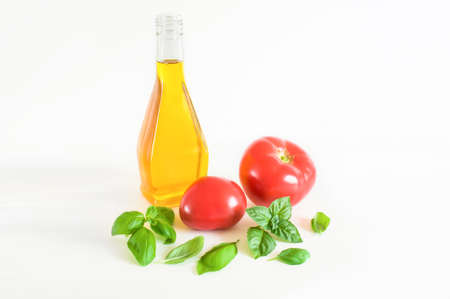 Fresh basil, tomatoes and olive oil. Salad Ingredientsの写真素材