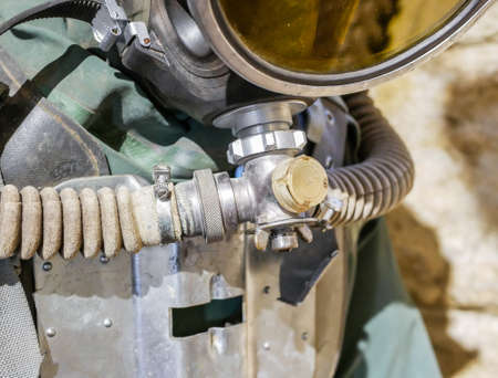 Close-up breathing apparatus on an old retro scuba diver suitの写真素材