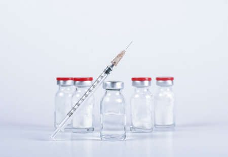 syringe and glass vials with medicine for injection close-upの写真素材