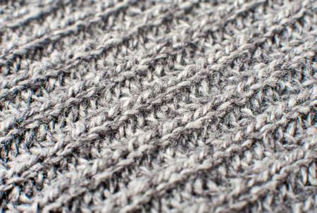 Texture of gray woolen knitted sweater closeup, macroの写真素材