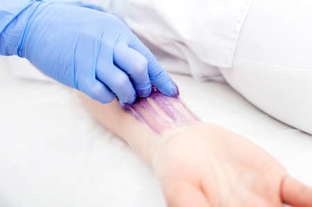 Chimneys in the boiler room against the blue sky. Steam smoke from pipes. Close-up. verticalの写真素材