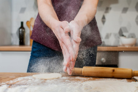 Girl preparing vegetarian pies with filling at home in the kitchen close-up. soft focusの写真素材