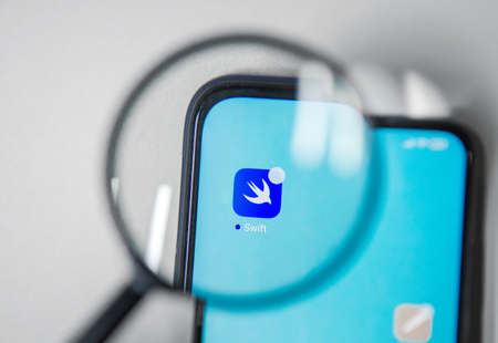 Voronezh, Russia - March 2, 2022 SWIFT app on smartphone screen under magnifying glassのeditorial素材