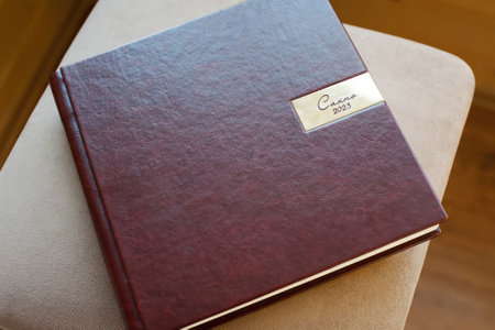 brown leather book with handmade engraving close-upの写真素材