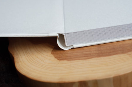 Close-up of leather bound photo album on wooden tableの写真素材