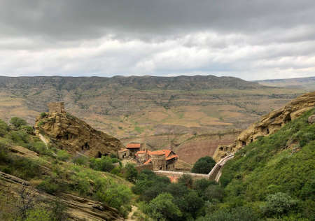 View of the ancient rocky monastery David Gareji. Since the 5th century, monks who wanted solitude and silence have stayed here. The monks carved their homes right in the rockの写真素材