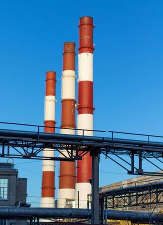 Industrial zone with broken red and white pipes. Ecology, environmental protection.の写真素材