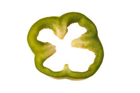 Sliced green bell pepper, isolated on white backgroundの写真素材