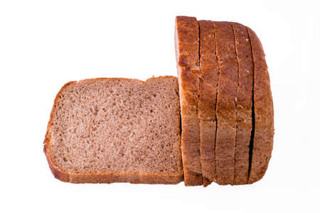 sliced slices of dark bread from a mixture of wheat and rye flour on a white background in isolationの写真素材
