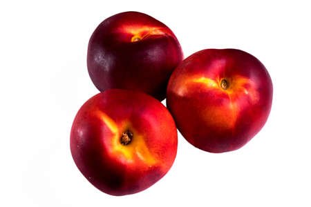three whole peach on a white backgroundの写真素材