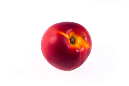 one whole peach on a white backgroundの写真素材
