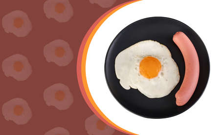 Fried egg and sausage on a black plate, on a white background, space for the text on a dark red backgroundの写真素材