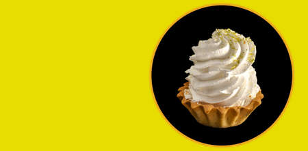 cake with protein cream on a black background, space for the text on a yellow backgroundの写真素材
