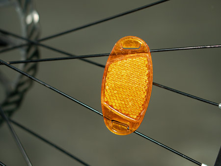 A reflector attached to the spokes of a bicycle wheel.の写真素材