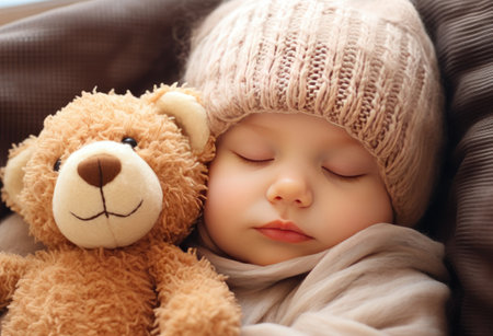 newborn baby sleeping on a fur blanket with ateddyの素材