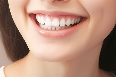 woman smiling wearing white dental flossの素材