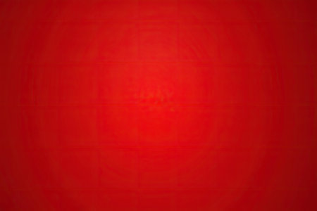 A close up of a red background with smoke emerging from itの素材
