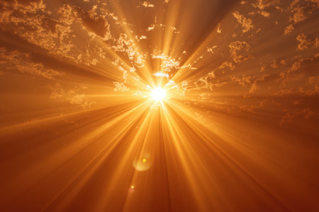 Bright sunburst shines through clouds, filling the sky with golden rays and warm light, creating a stunning natural display of beauty and tranquilityの素材