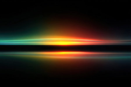 Vibrant light streaks in shades of orange, blue, and green create a stunning gradient effect against a dark background, evoking a sense of depth and tranquilityの素材