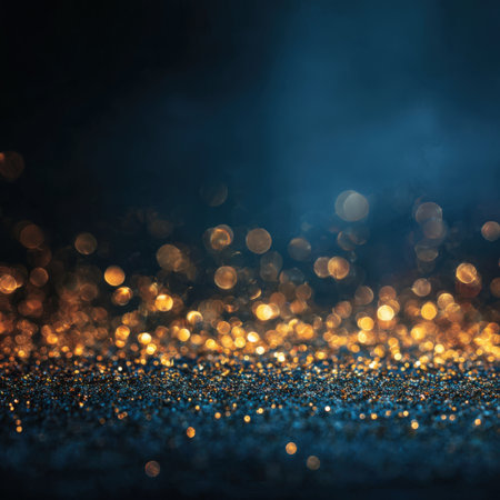 Close-up view of shimmering bokeh lights in golden and blue hues, set against a dark background, creating a magical and enchanting atmosphere for artistic useの素材