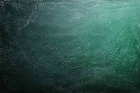 Green chalkboard background features a textured surface with scratches and marks, providing a rustic feel ideal for educational or artistic projectsの素材