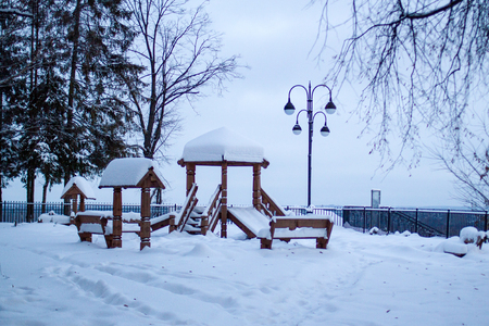 wooden winter hill in the cityの写真素材