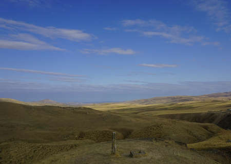 Lonely Steadfast Pillar under the Blue Sky in Azerbaijani Desertの写真素材