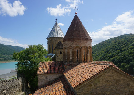 Ananuri Castle Complex View of Two Churches with Crosses River and Blue Sky Backgroundのeditorial素材