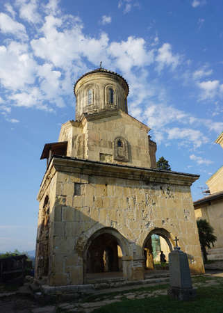 Gelati Monastery Chapel Tower with Grave Stone and Crossのeditorial素材