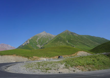 Georgian Military Highway Windy Roads with Two Mountain Peaks