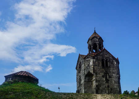 Haghpatavank Monastery Bell Tower on Hill in Summer with Blue Skyの写真素材