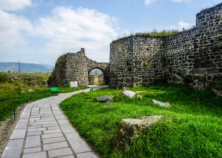 Lori Berd Fortress Gate with Paved Road and Walls on a Cloudy Dayのeditorial素材