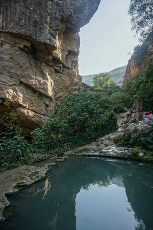 Tatev Devils Bridge Pond with Rocks and Security Fenceのeditorial素材