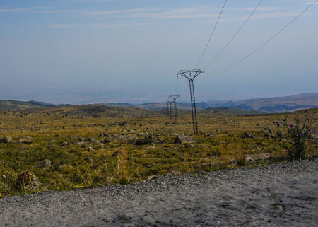 Mount Aragats Power Lines with Rocky Grass Land
