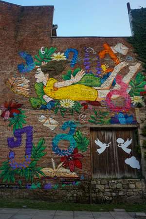 Kutaisi Street Art Flying Girl View Depicted on House Facadeの写真素材