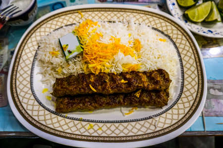 Mouthwatering Tasty Iranian Kabab Koobideh with Rice Saffron and Butterの写真素材