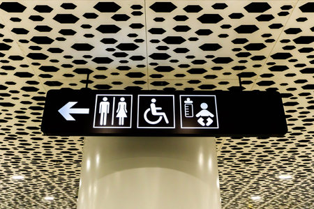Airport White Colored Restroom Sign for Disabled and Babies on Black Board