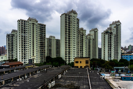 Shanghai Multi Level Highrise Apartment Building with Cloudy Rainy Sky Background