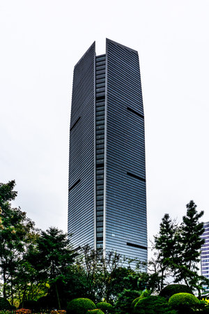 Shanghai Multi Level Highrise Commercial Building with Cloudy Rainy Sky Background