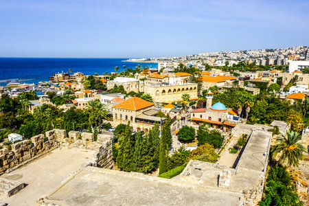 Byblos Crusaders Citadel Courtyard Ruins with Cityscape and Sea Viewの写真素材